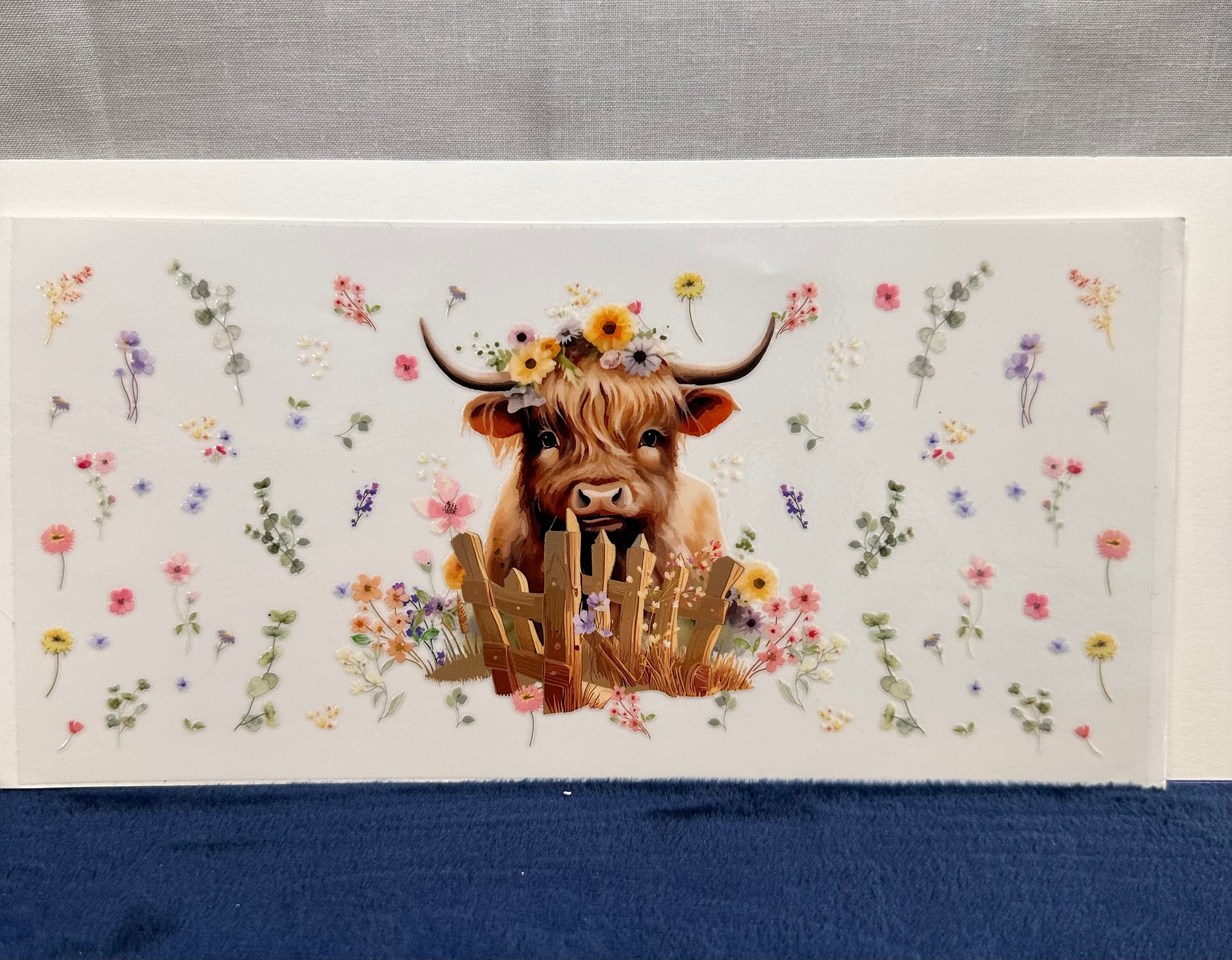 Cow in Fence with Spring Flowers